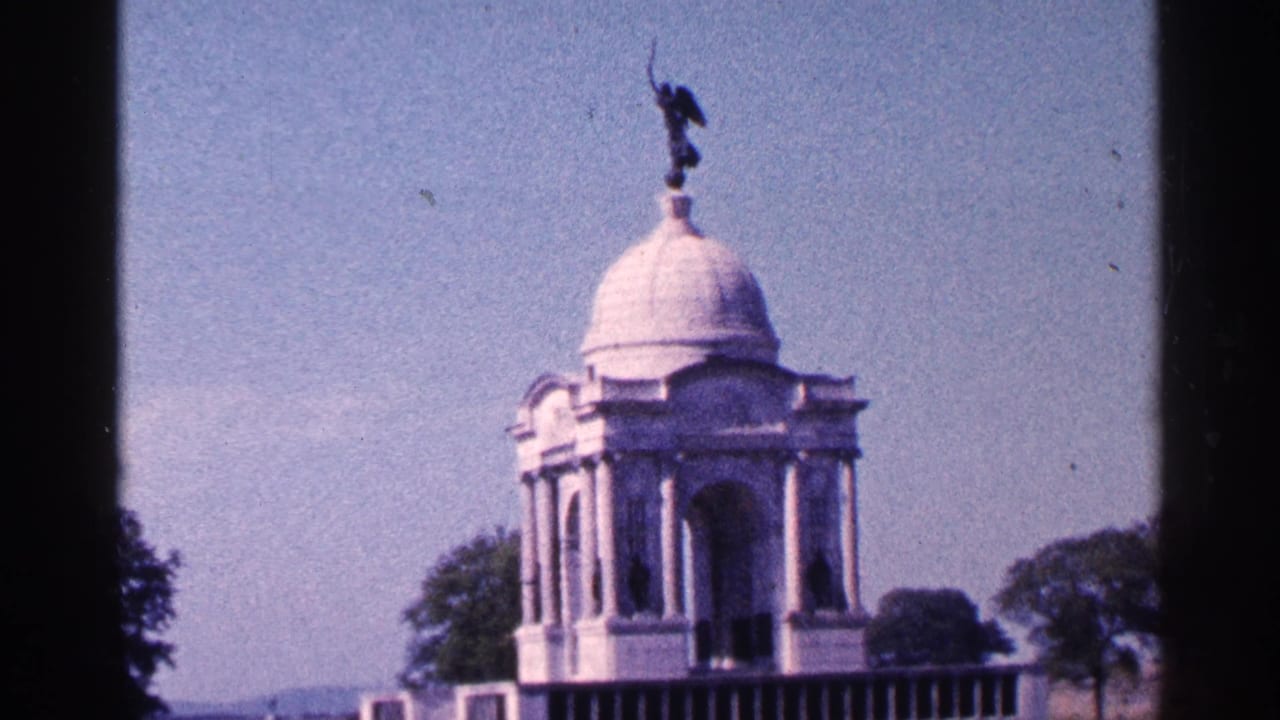 Visitor-shot 1964 Pennsylvania view of a white domed memorial structure with columns, trees, and clear sky.