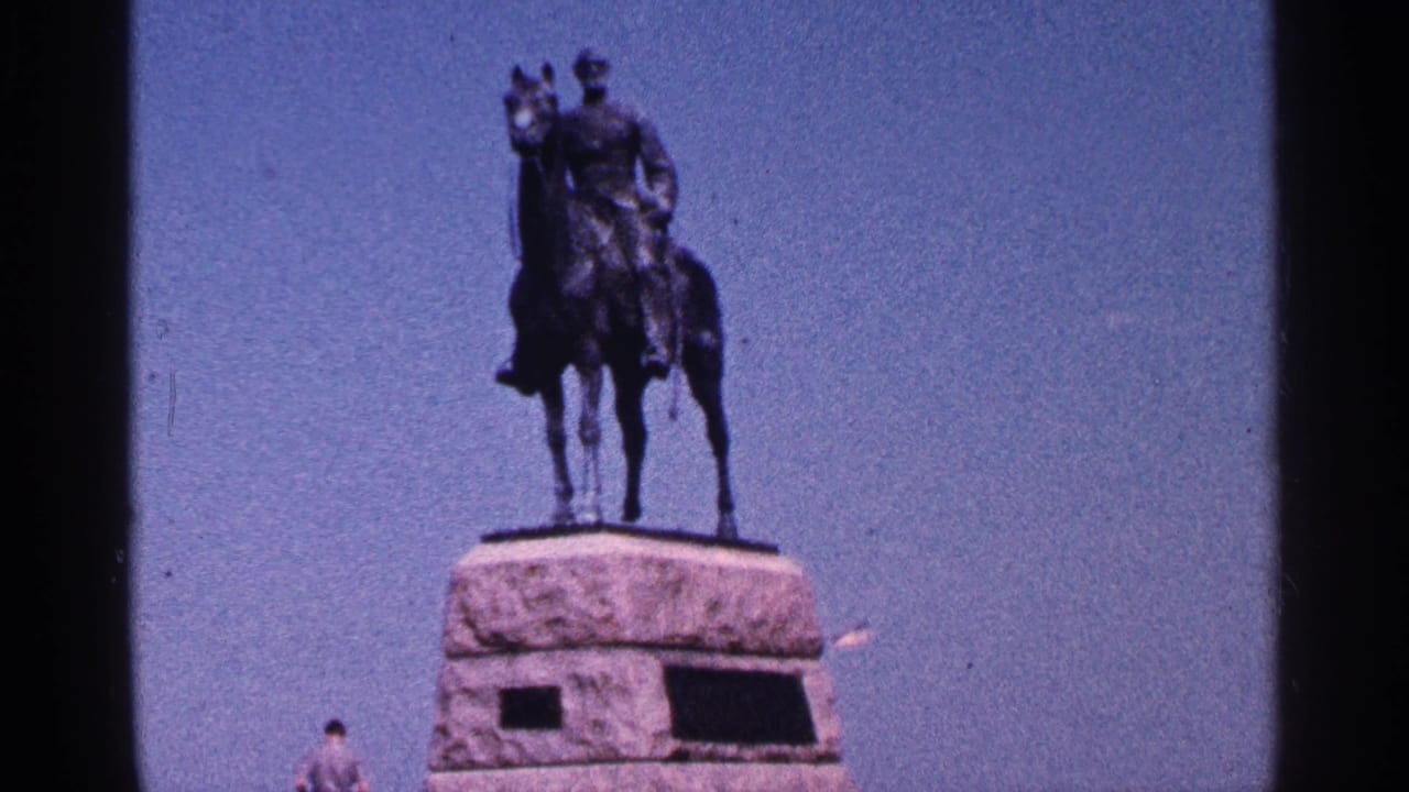 1964 Pennsylvania home-movie view of the mounted George G. Meade monument, with the pedestal and a distant visitor partly visible.