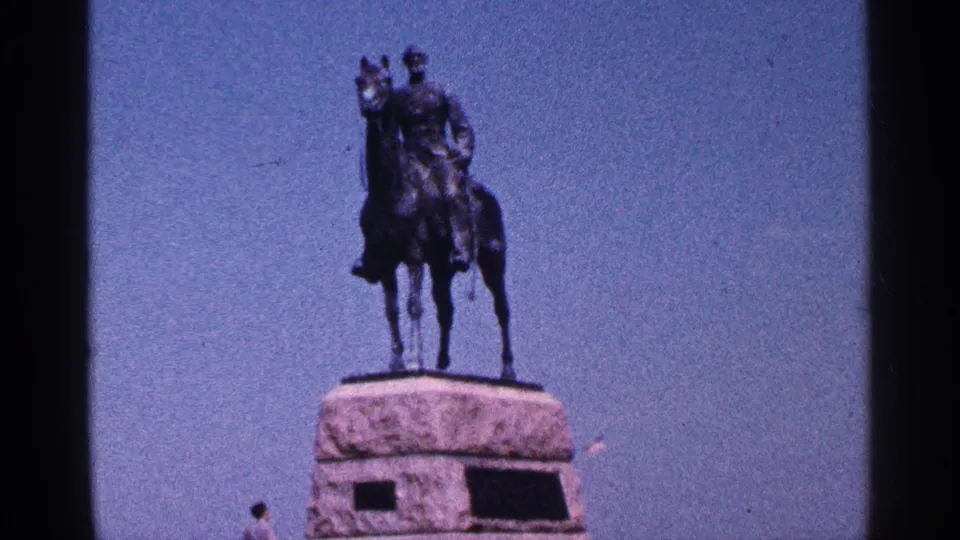 1964 Pennsylvania 8mm frame with the equestrian statue filling more of the frame, filmed from a low visitor viewpoint.