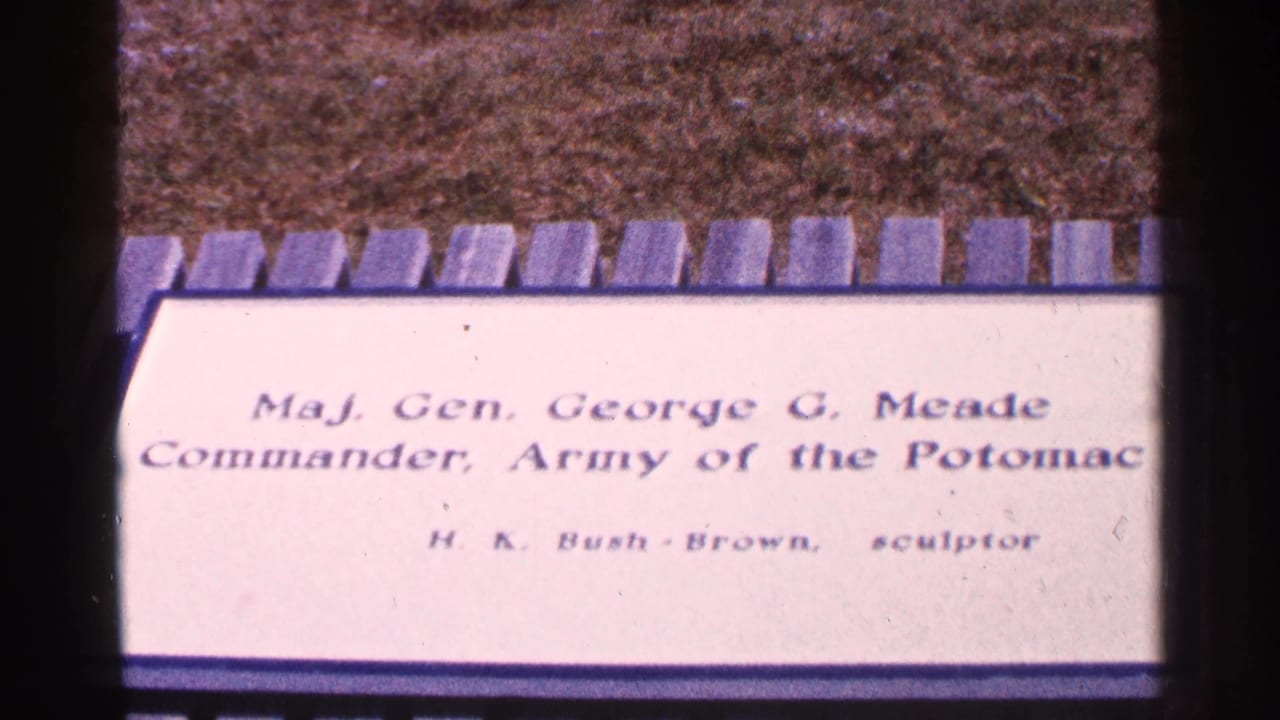 Close view of a plaque naming Maj. Gen. George G. Meade with stone edging above.