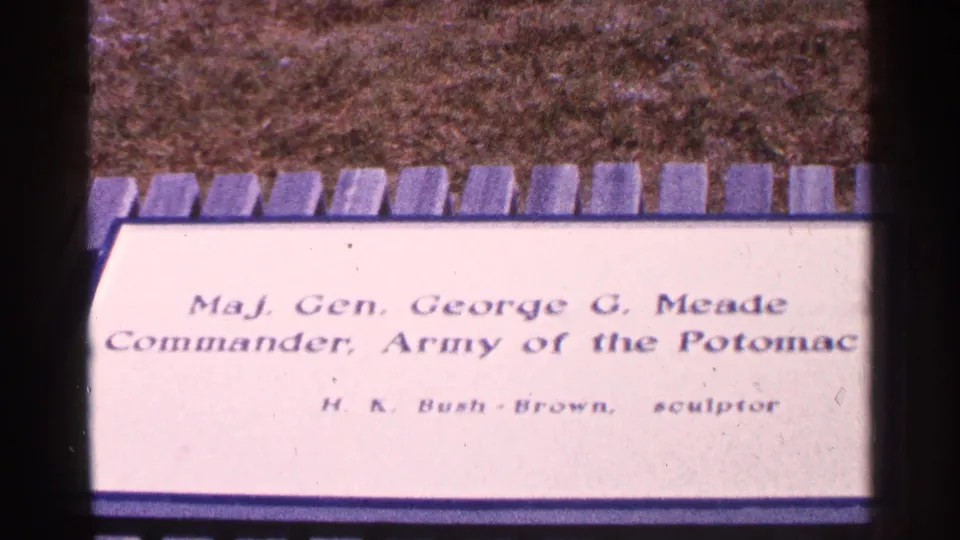 1964 8mm frame showing a cream plaque for Maj. Gen. George G. Meade, Commander of the Army of the Potomac, with stone edging visible above.