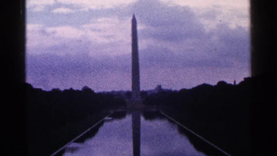 1964 Washington, D.C. home-movie frame showing the Washington Monument and its reflection in the Reflecting Pool.