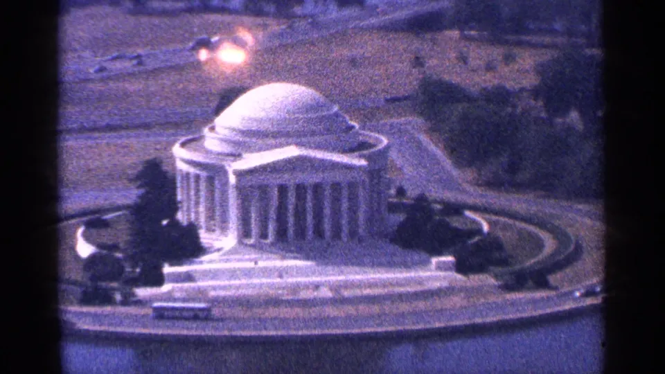 1964 Washington, DC elevated view of the Jefferson Memorial with its dome, columns, circular roads, water, and surrounding grounds.