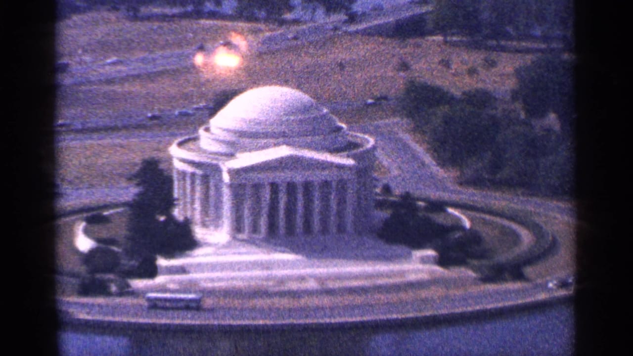 Aerial view of the Jefferson Memorial with surrounding water, trees, and roadways.