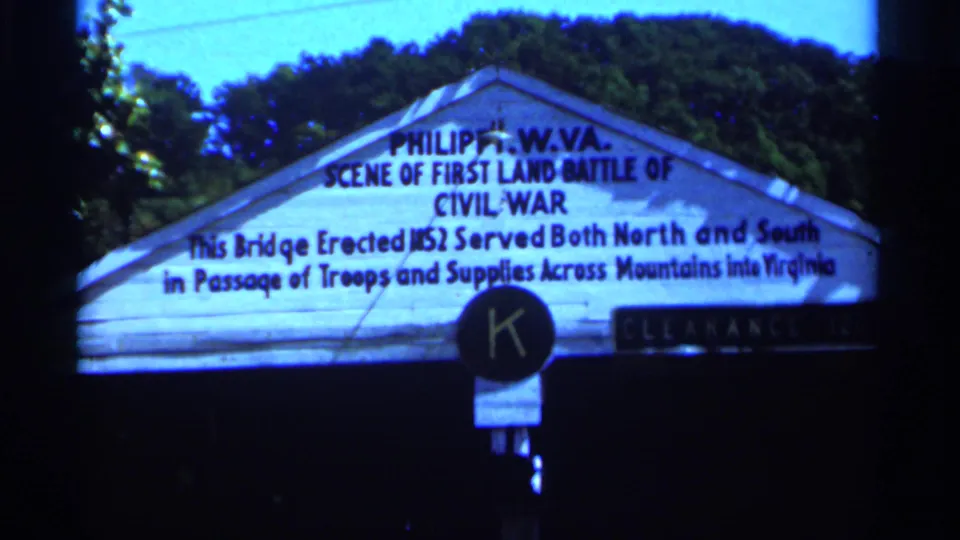 West Virginia 1964 8mm frame with a closer view of the Philippi Civil War marker and roadside clearance signage.