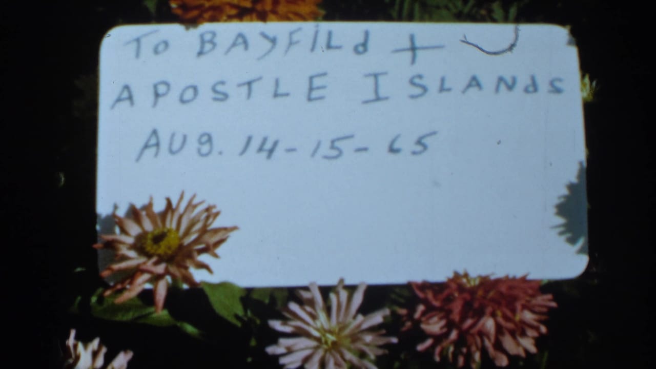 Handwritten card reading Bayfield and Apostle Islands above flowers.