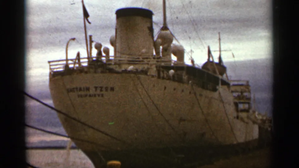 Duluth port view from 1965 showing the bow of the Captain Tzun docked with rigging and deck structures visible.