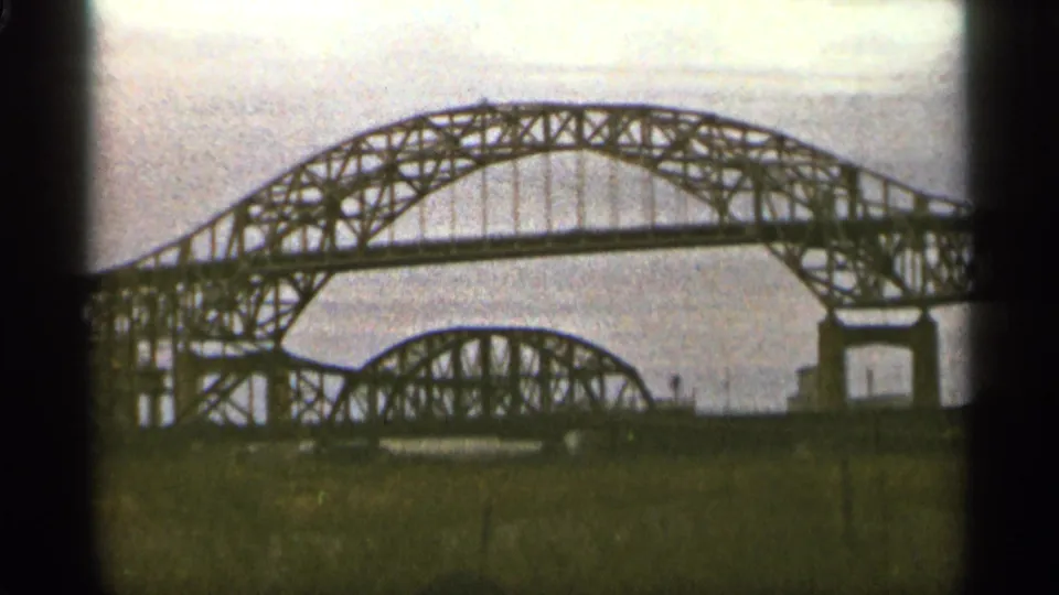 1965 Duluth frame showing the Mel Bridge area as a steel truss arch span with a smaller span behind it.