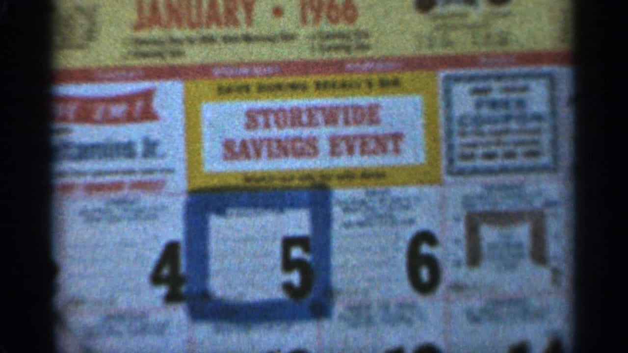 Close-up from Duluth-area 8mm footage showing a January 1966 Storewide Savings Event calendar with dates 4, 5, and 6 visible.