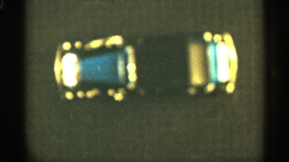 1965 Duluth home-movie frame with the miniature blue car more centered and a gold-toned end visible.
