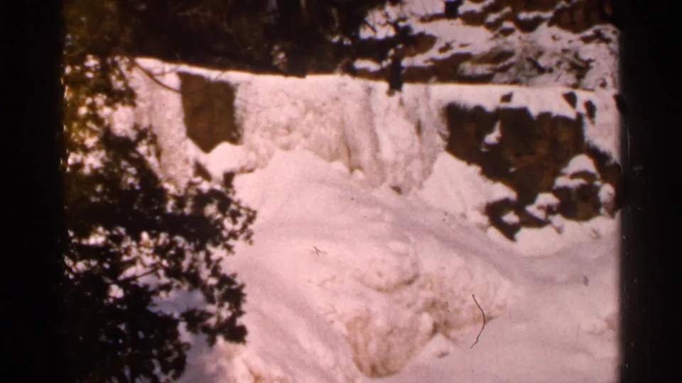 Final view of the Eau Claire winter snow drift, with trees and rocks rendered in warm faded 8mm color.