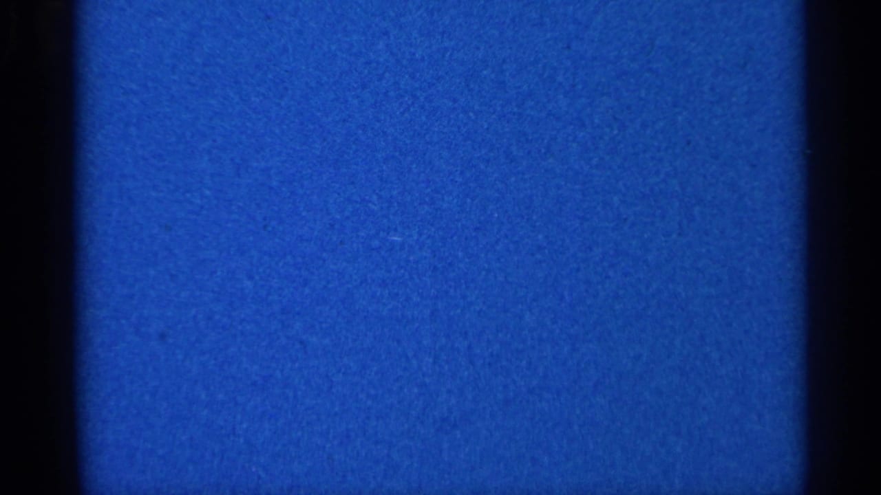 Blue textured film frame with dark vertical borders.