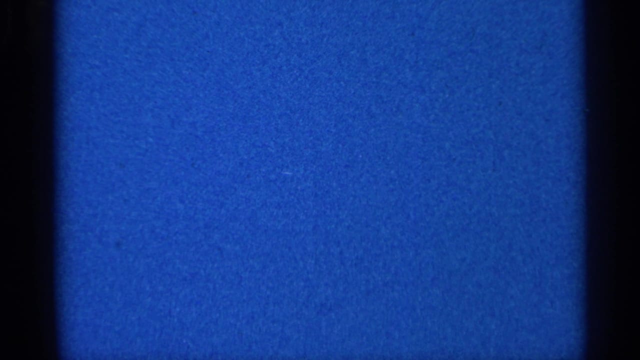 Blue textured frame with dark gate edges and grain.