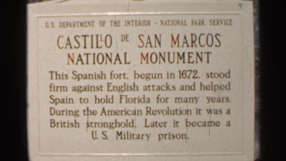 Final close-up frame of the Castillo de San Marcos National Monument plaque, with official NPS header and readable fort history text.