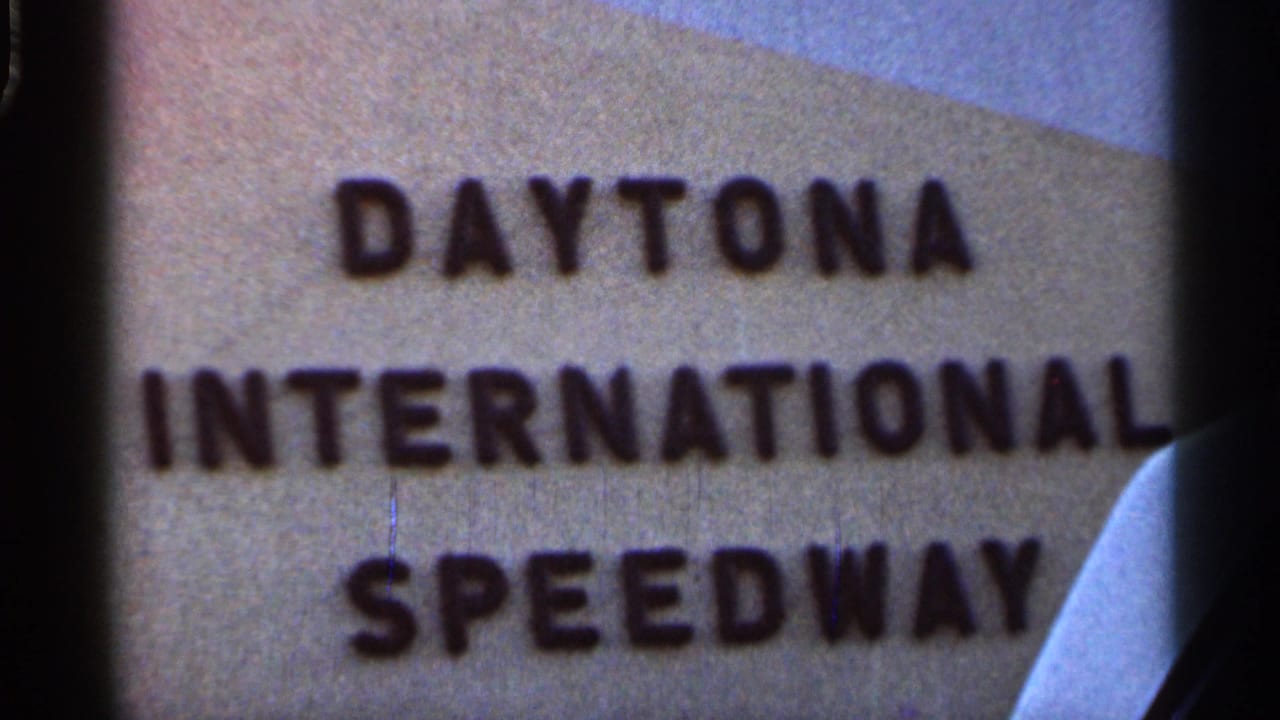 Close view of Daytona International Speedway sign lettering with film gate edge visible.