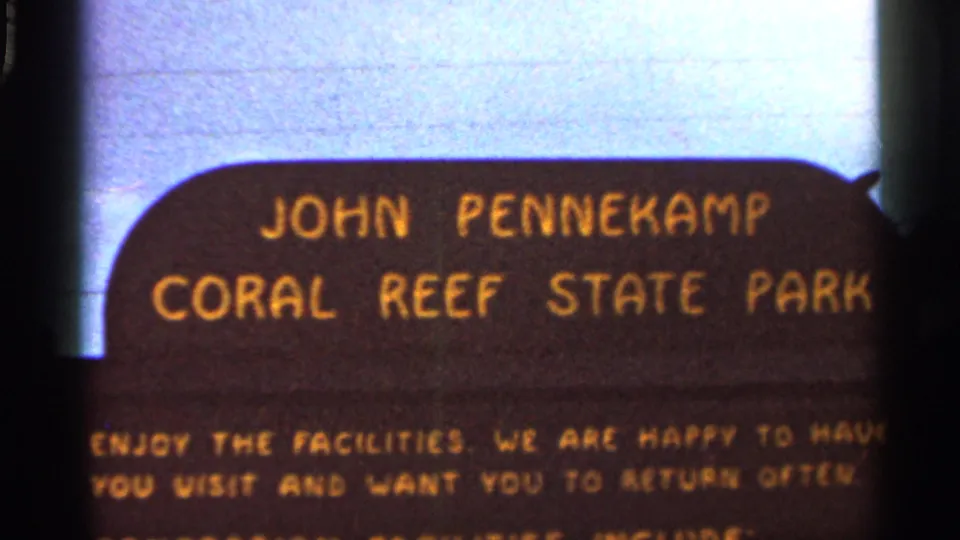 1966 Florida frame with the John Pennekamp Coral Reef State Park sign filling most of the view, including partial welcome wording.