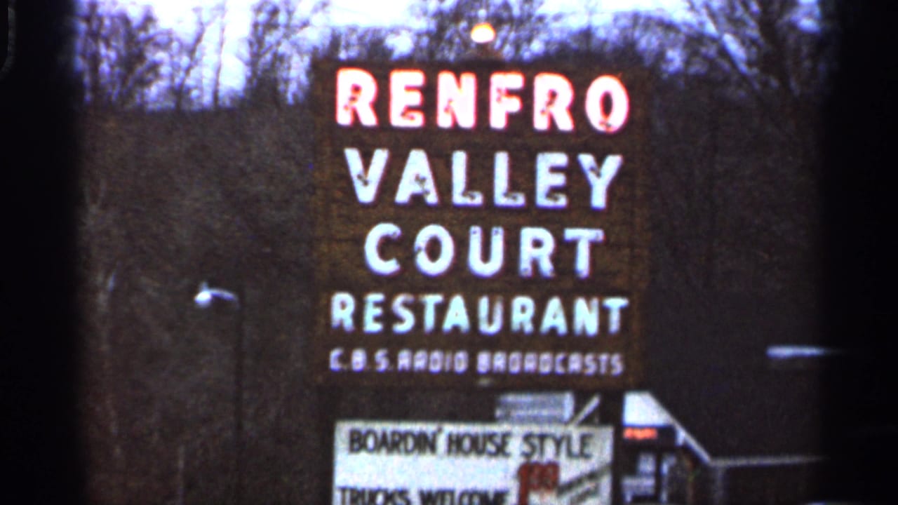 Renfro Valley Court Restaurant sign against bare trees, with smaller sign text below.