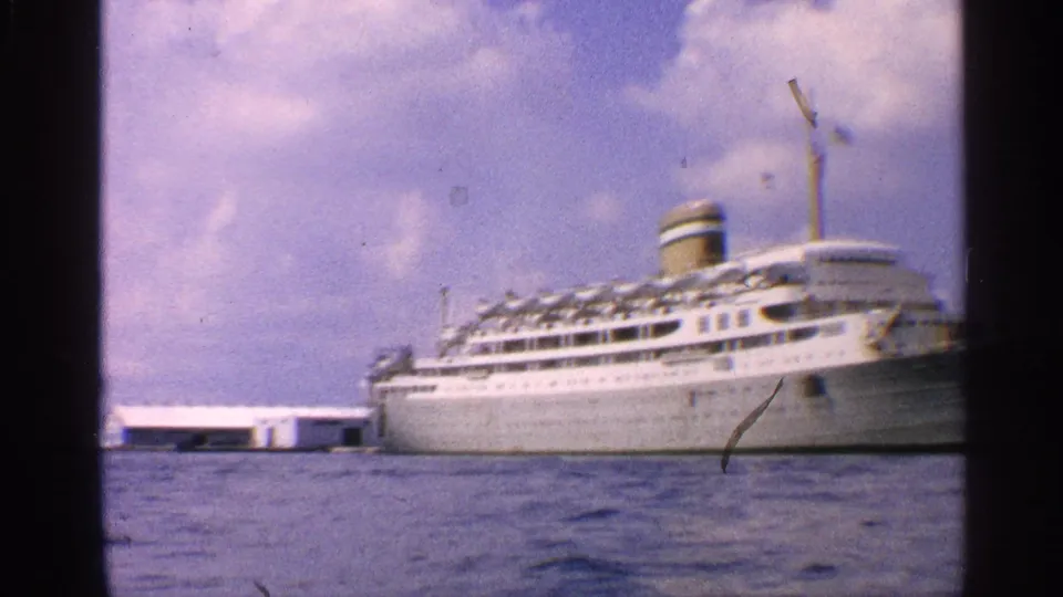 Final frame shows the docked liner across the harbor with visible 8mm gate edges and surface marks.