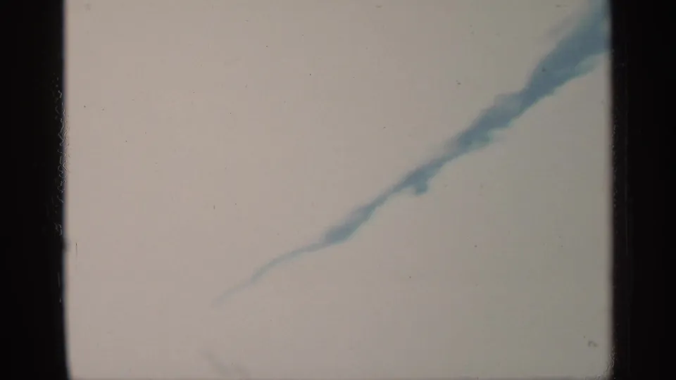 1959 Florida 8mm frame showing abstract blue-white rippling water with soft exposure and visible film borders.