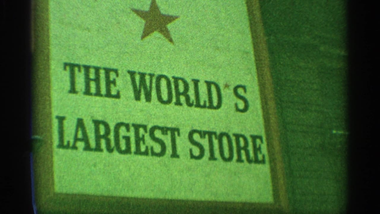 1959 New York frame showing a green Macy's sign panel reading The World's Largest Store beneath a star emblem.