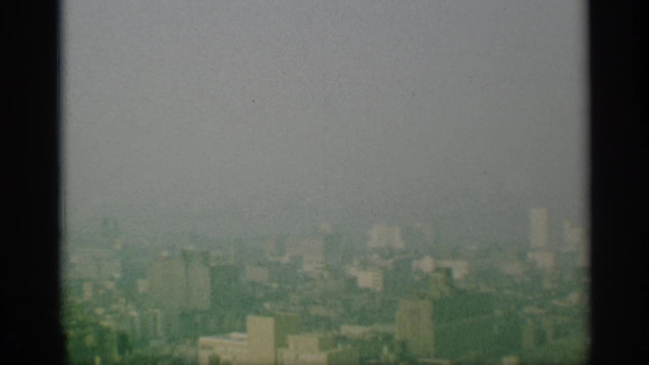 The final frame shows a broad, washed 1959 New York cityscape with rooftops and distant buildings fading into haze.
