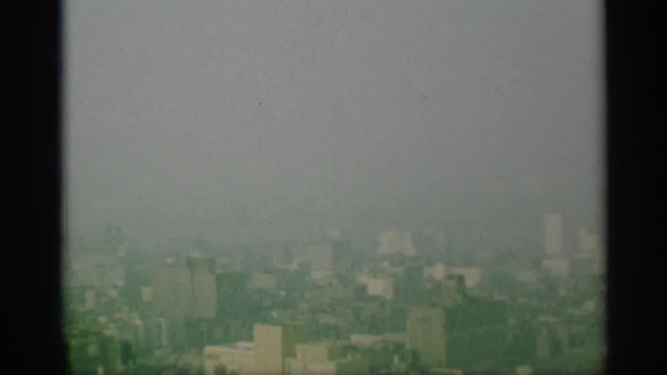 The final frame shows a broad, washed 1959 New York cityscape with rooftops and distant buildings fading into haze.