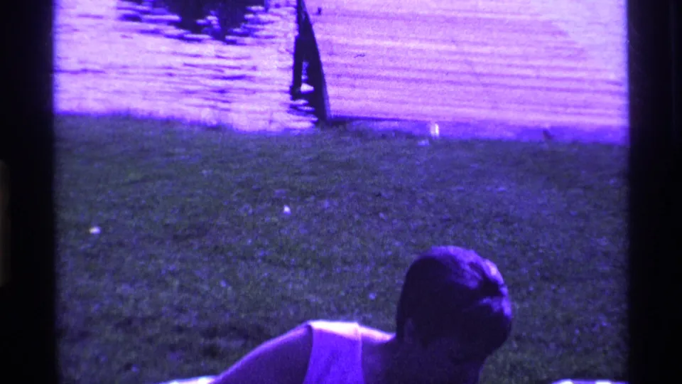 The final frame partially crops the woman as she bends forward near the chair, with grass and water visible in the background.