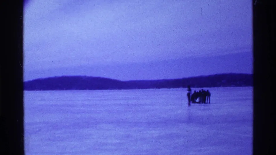 Near the end of the clip, the group appears farther out on the frozen Ohio lake, standing by the sled beneath an overcast sky.