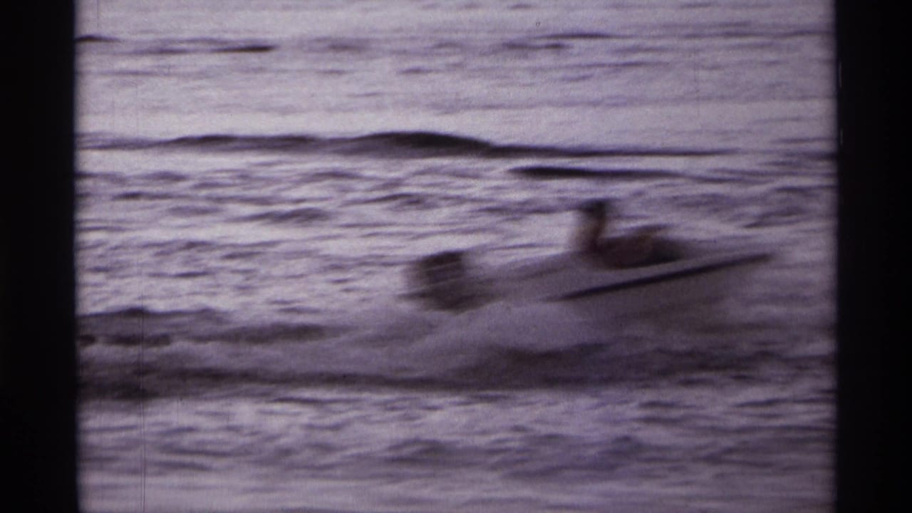 Blurred speedboat moving quickly across lake water.