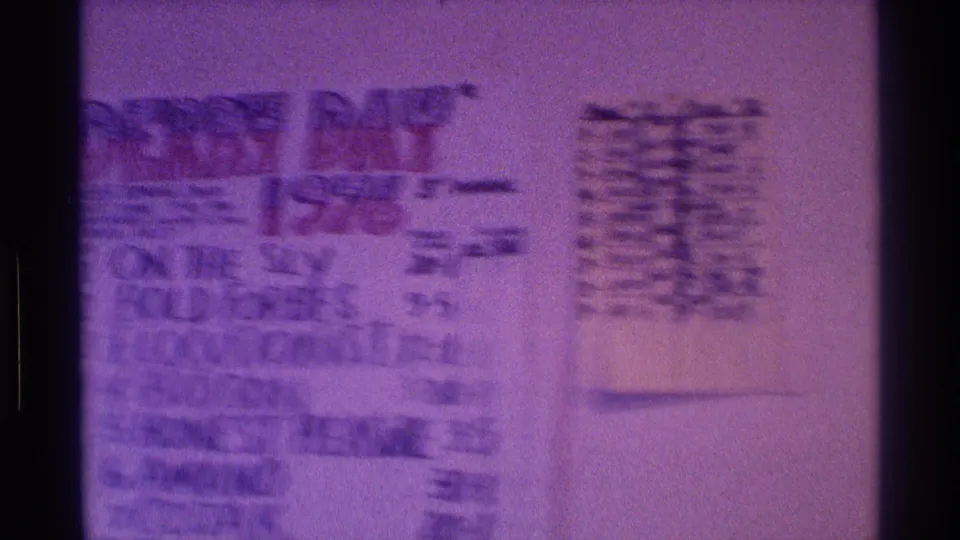 The frame centers on a Derby Day 1976 handwritten board, with horse names and odds visible in a private indoor room.