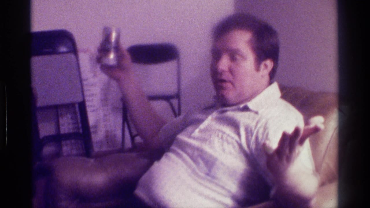 Man reclines with one hand open and a beer can held near his shoulder.