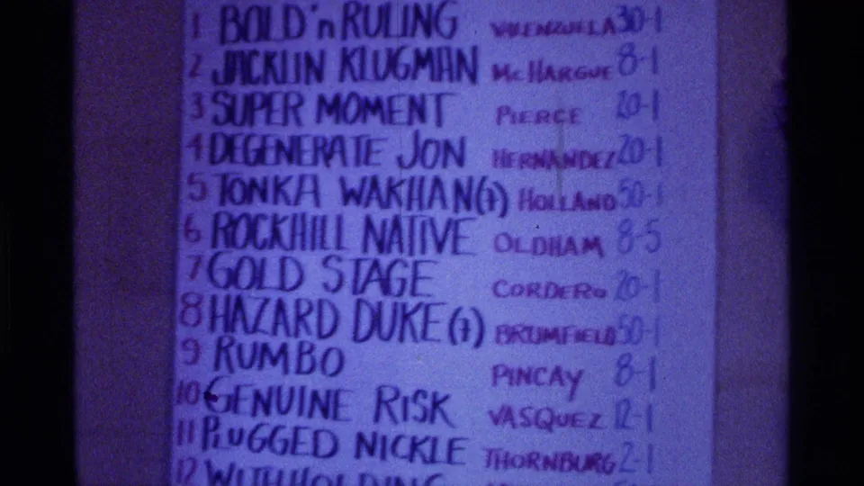 Close 8mm view of a handwritten Kentucky horse racing chart with entries such as Bold 'n Ruling and Jacklin Klugman.