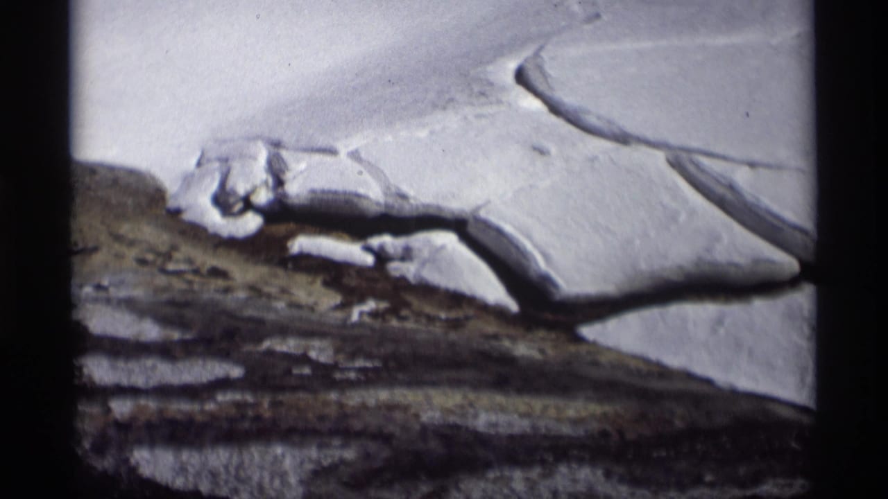 Madison, Wisconsin winter landscape from 1966 with broken snow or ice edges over exposed earth.