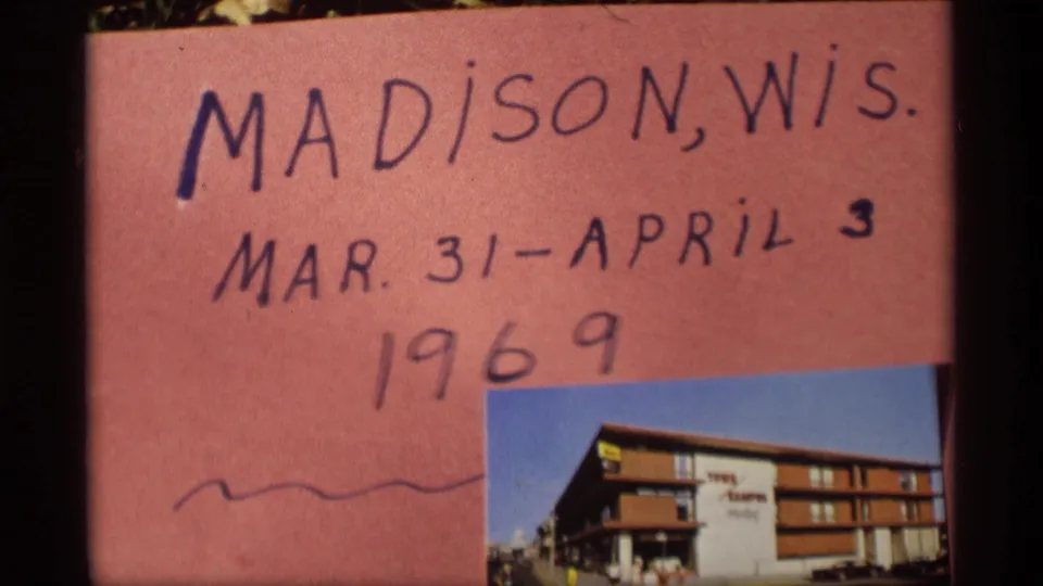 Handwritten title card confirming Madison, Wisconsin, with dates March 31-April 3, 1966, and a small motel-like exterior photo attached.