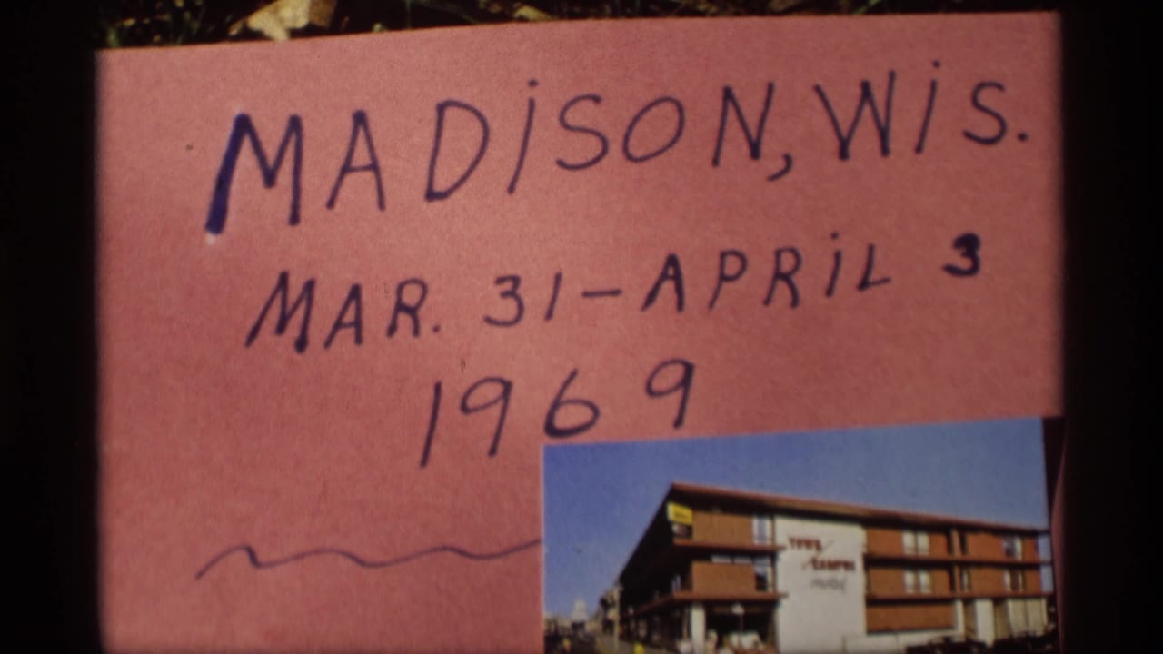 Handwritten pink title card reading Madison, Wis. with dates and a small building photo.