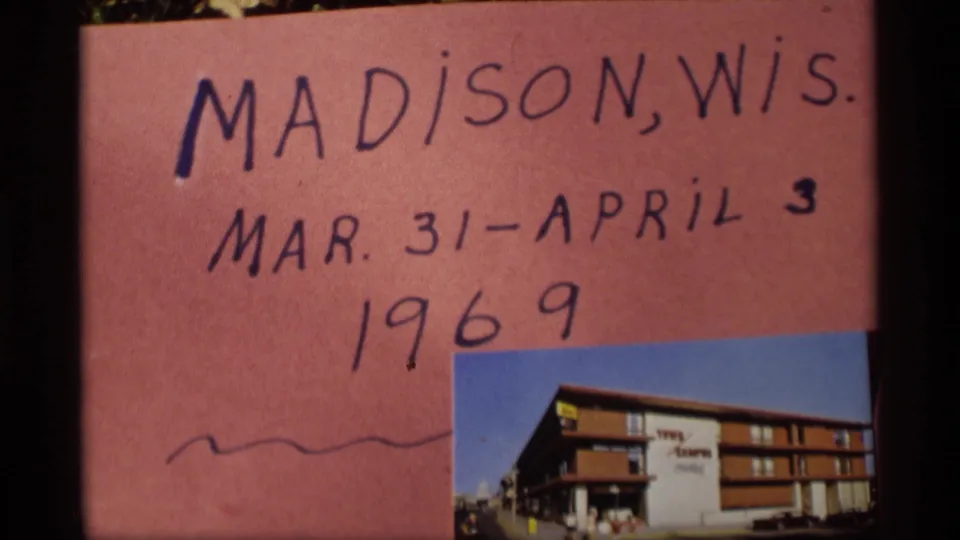 Close view of the handwritten Madison, Wisconsin card, including March 31-April 3 and 1969, with a small exterior building photo.