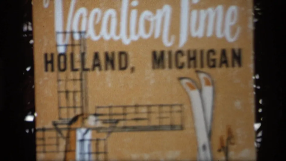 Soft 8mm frame of the Holland, Michigan title card, with large Vacation Time lettering across the top.
