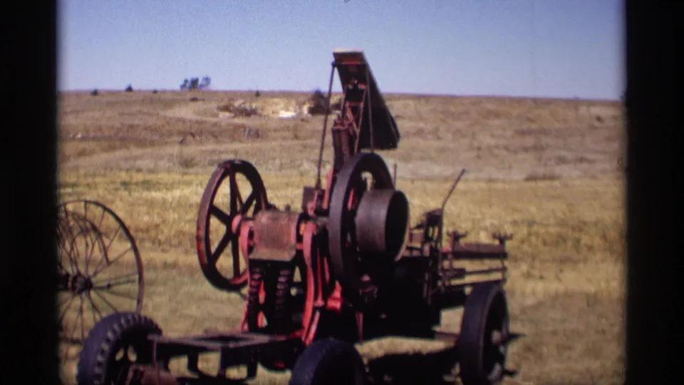 A second piece of historic farm machinery appears in the Jordan, Minnesota field near the end of the 1969 clip.