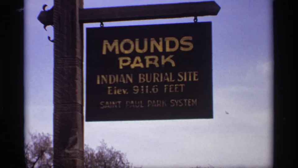 1969 Saint Paul frame showing a Mounds Park Indian Burial Site sign in the Saint Paul Park System.