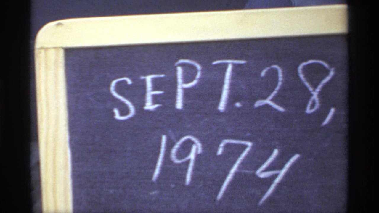 Handwritten chalkboard date reading SEPT. 28, 1974 in a pale wooden frame.