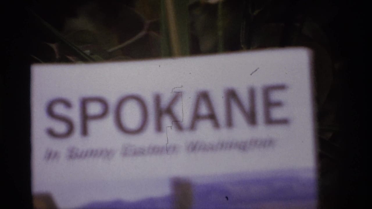 Soft close view of a Spokane pamphlet with printed landscape art.