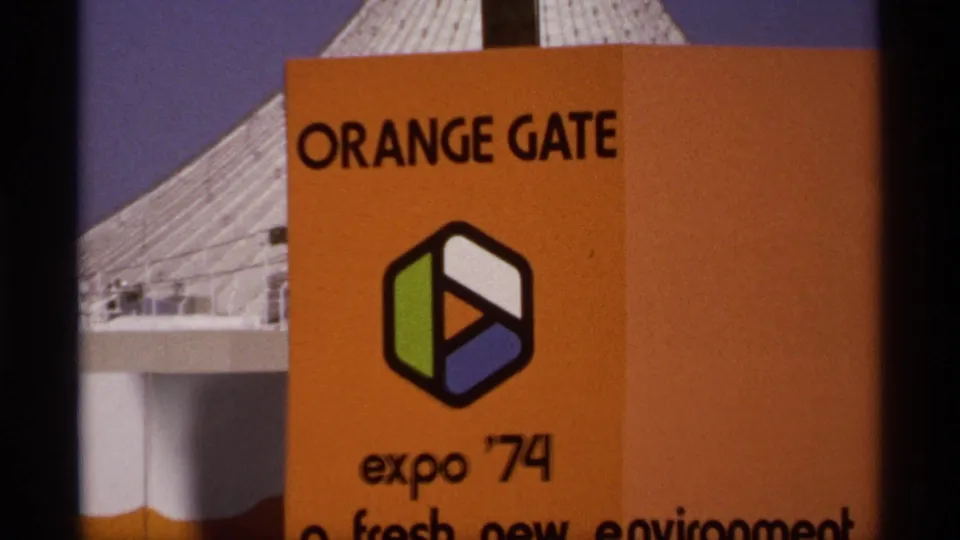 1974 Spokane Expo close-up showing Orange Gate signage, the Expo '74 logo, and part of the fresh environment slogan.