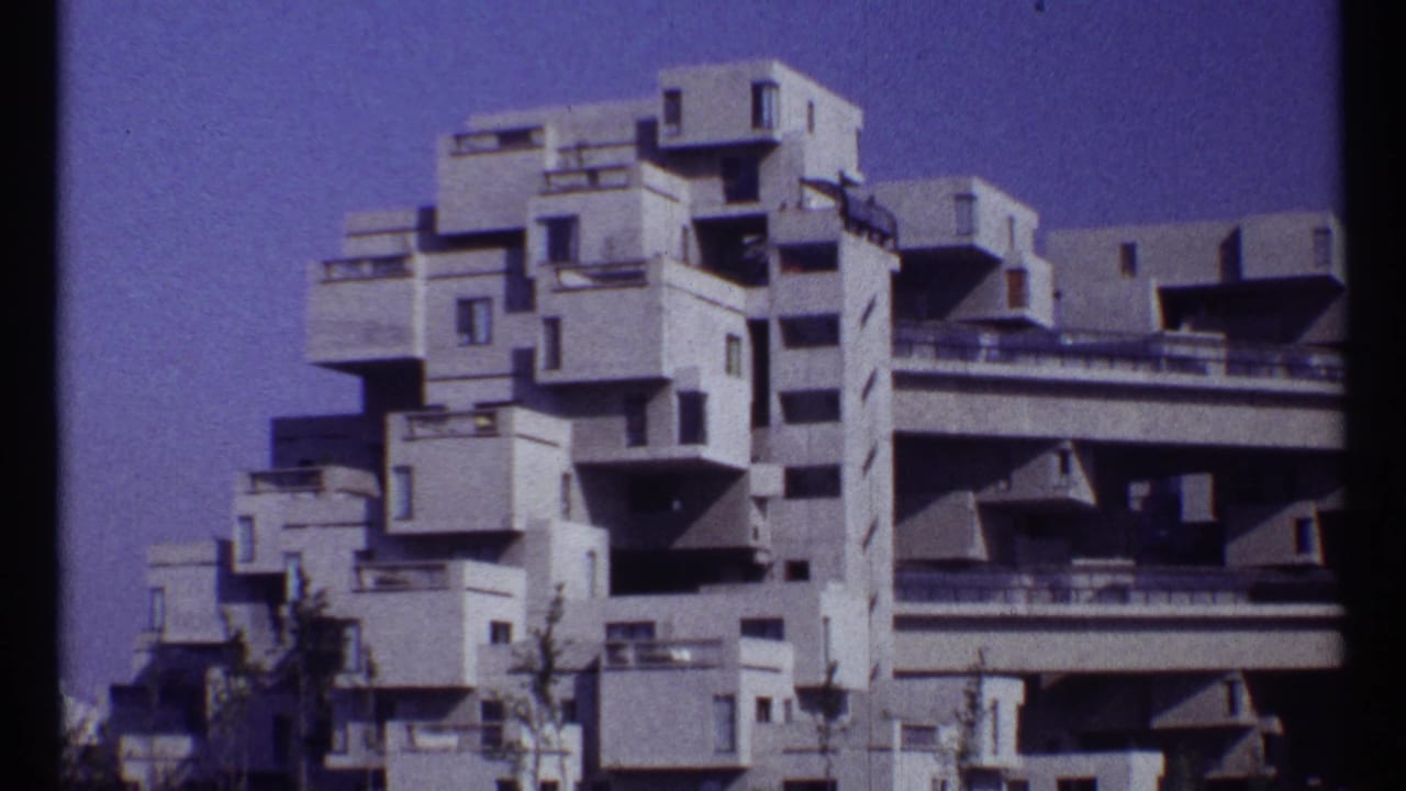 Habitat 67 modular concrete apartments under a blue sky.