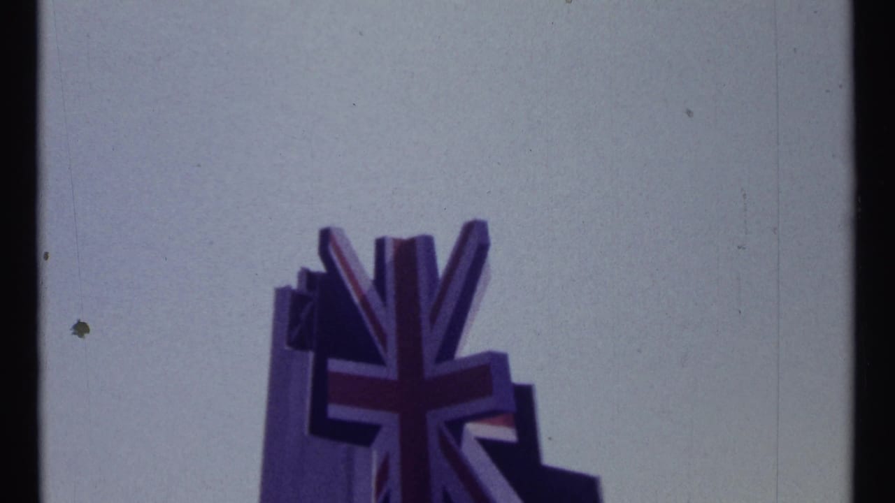 Union Jack-shaped sign or flag form above a pale sky.