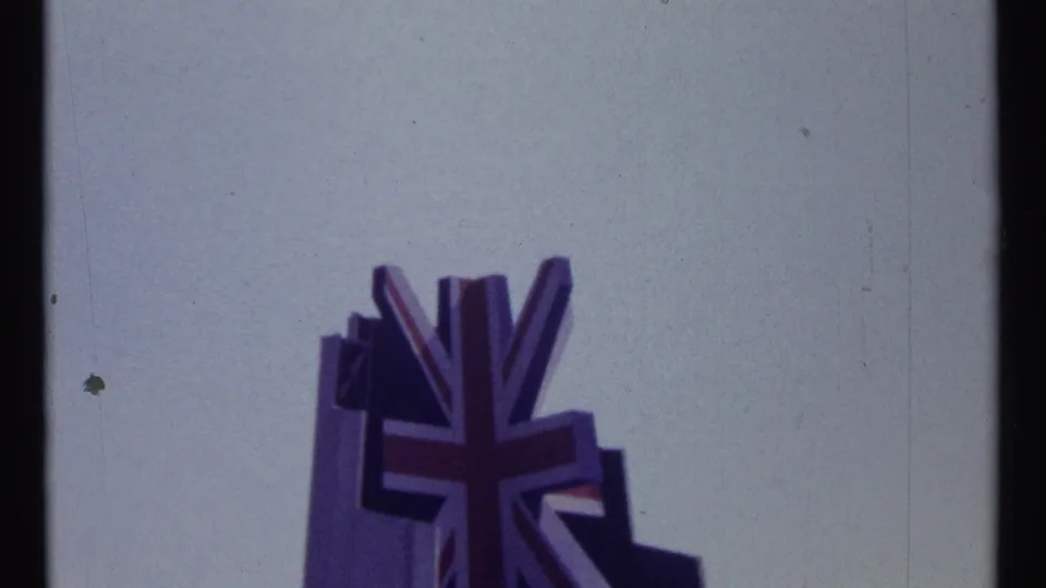1967 Montreal 8mm frame showing a Union Jack-shaped emblem or flag form rising against a pale sky.