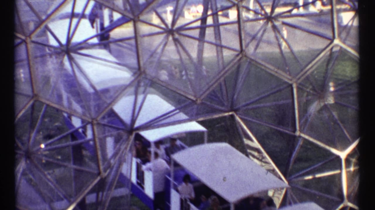1967 Montreal footage shows a trolley carrying passengers beneath the triangular glass structure of a geodesic dome.