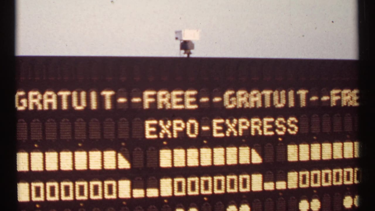 Illuminated bilingual Expo-Express sign with blocky train graphics.