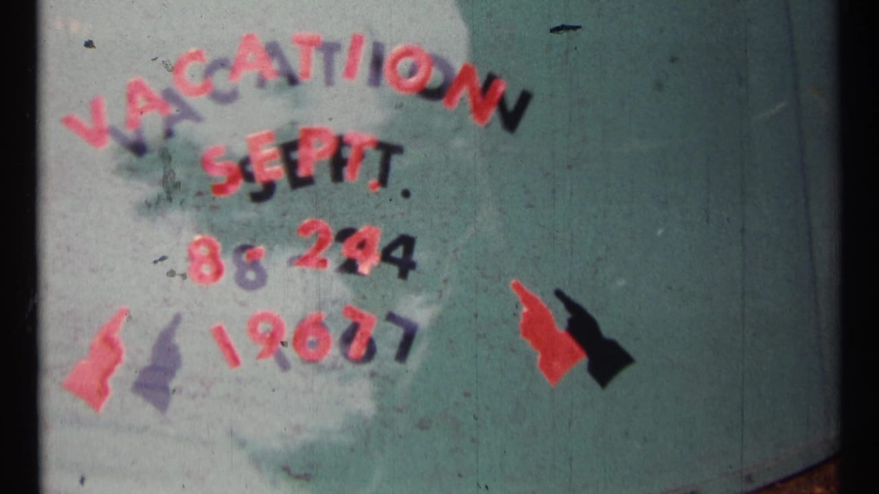 1967 Ottawa vacation title card on a teal surface, with red and black hand-painted lettering reading Vacation Sept. 8-24 1967.