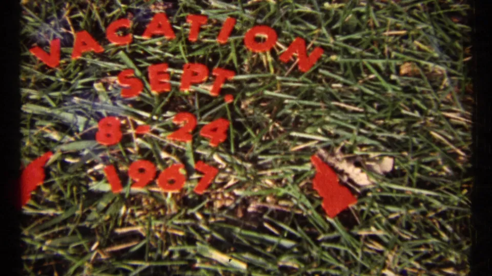 The vacation title appears on grass, with red hand-painted letters and arrows marking the September 1967 travel dates.