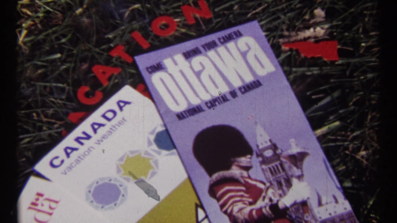 Ottawa and Canada brochures on grass with red lettering partly visible behind them.